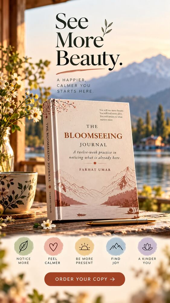 The Bloomseeing Journal on a table overlooking a lake in Kashmir