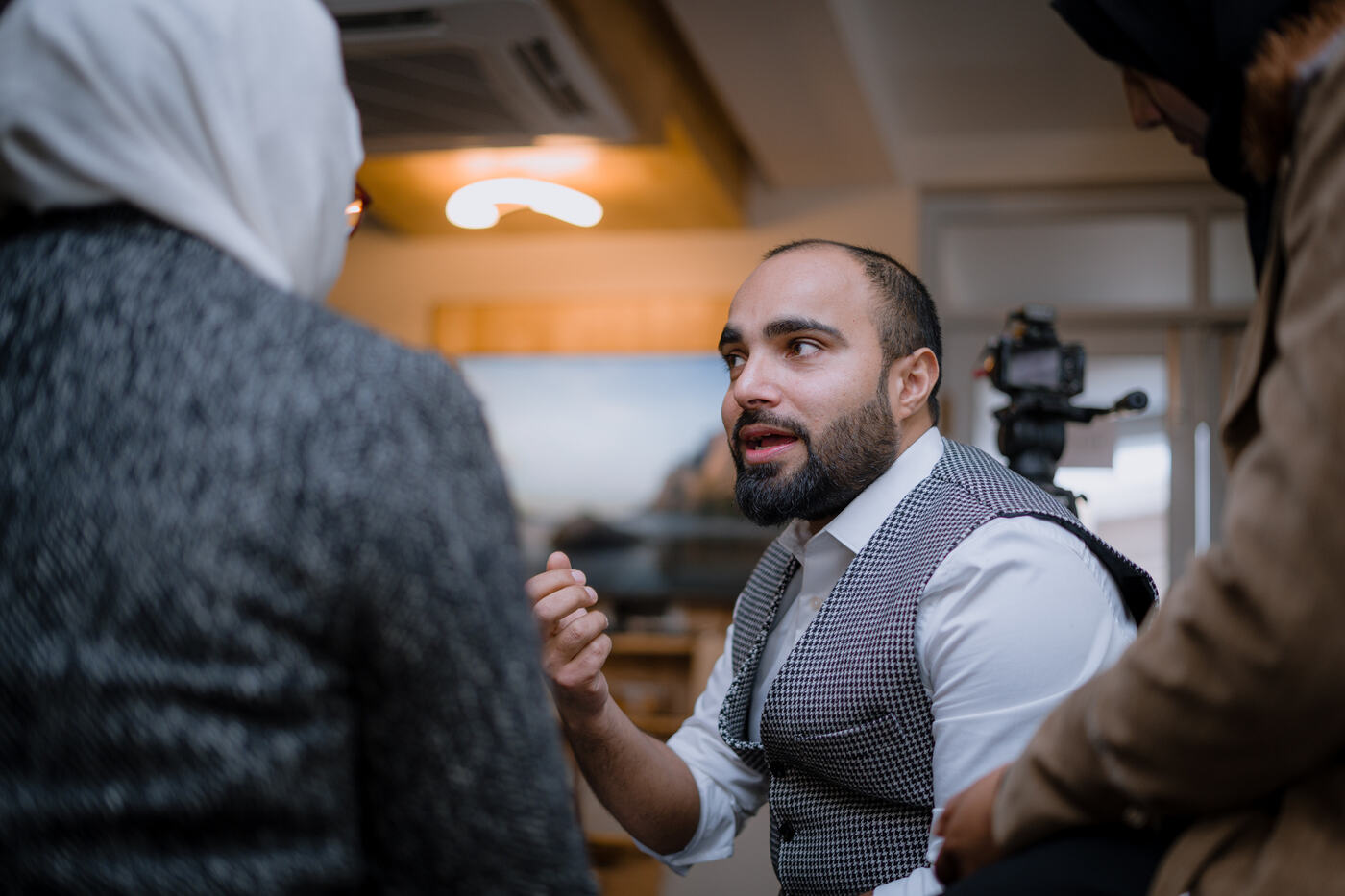 Farhat in conversation during a filmed session