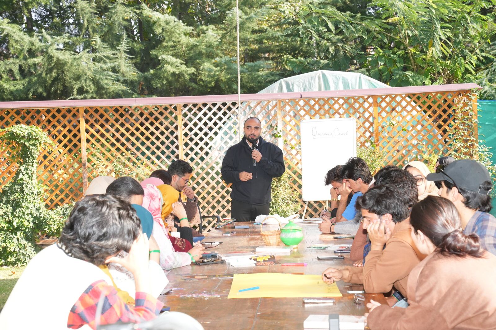 Farhat Umar leading a Bloomseeing Journal session in a garden
